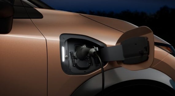 Close-up image of charging cable plugged in | Performance Nissan of Pompano in Pompano Beach FL