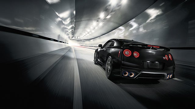 2023 Nissan GT-R seen from behind driving through a tunnel | Performance Nissan of Pompano in Pompano Beach FL